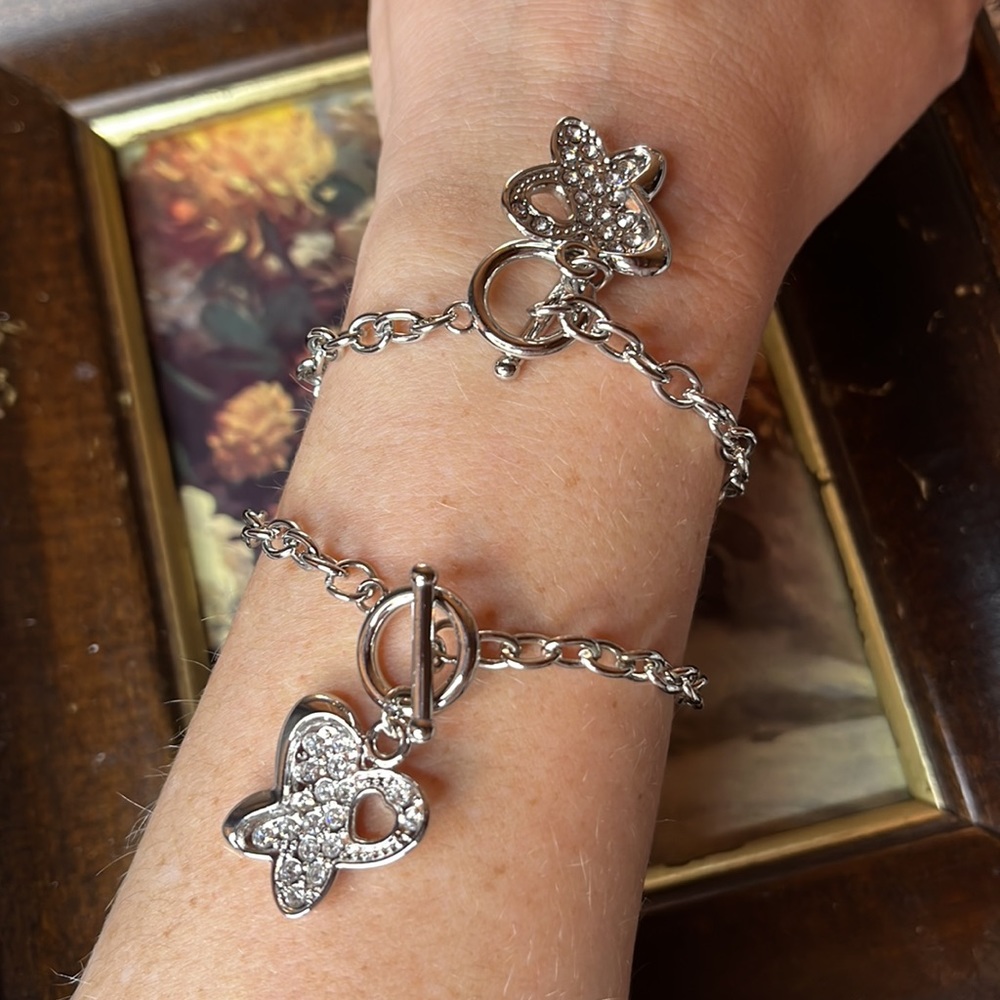 2 Butterfly bracelets silver toned